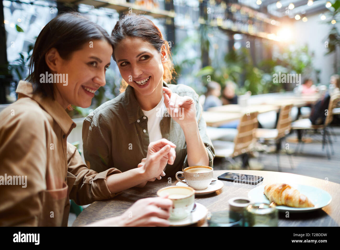 Gossiping About People In Cafe Stock Photo Alamy