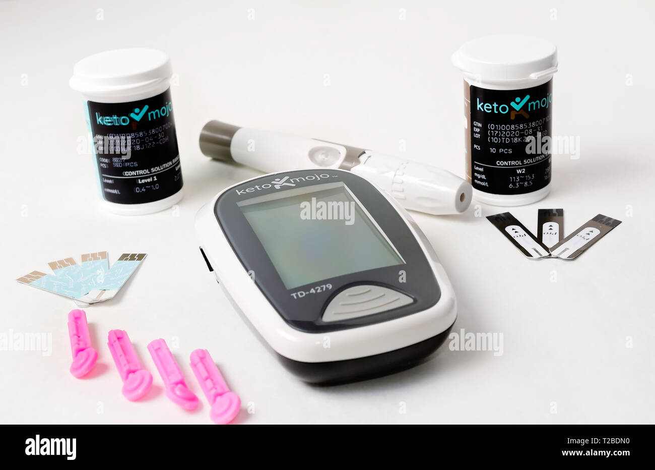 A Keto-Mojo ketone and blood glucose meter is pictured on white