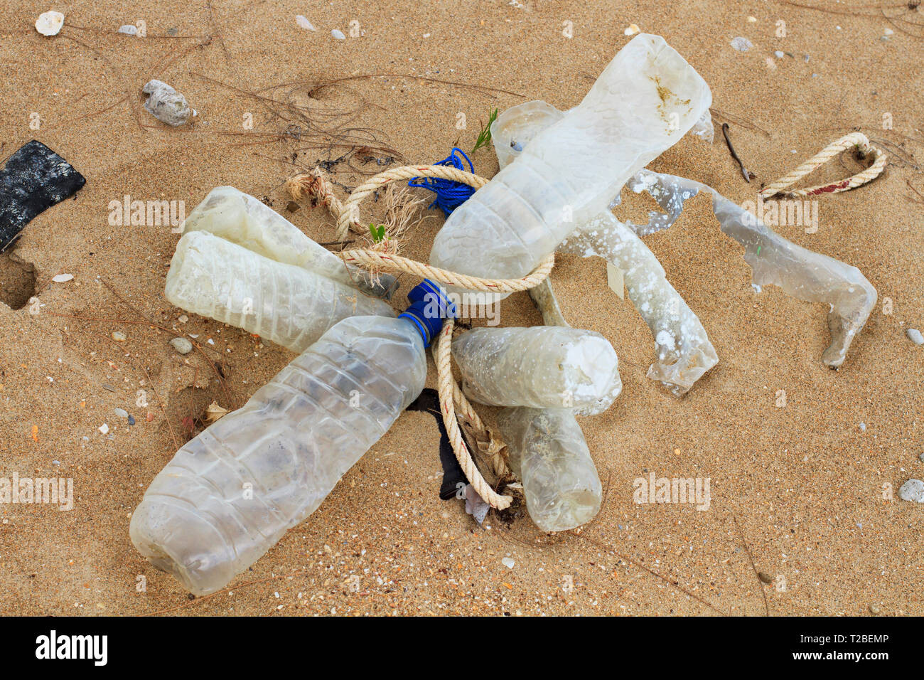 Discarded plastic water bottles found on a beach on the west coast of Cape York, Australia.   Bottles had been dumped from fishing vessels operating i Stock Photo