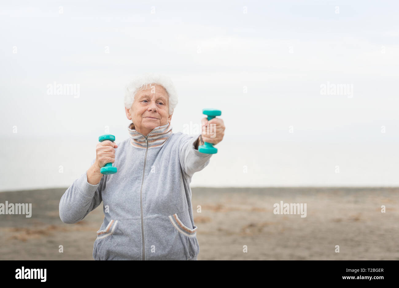 senior woman exercising outdoor Stock Photo