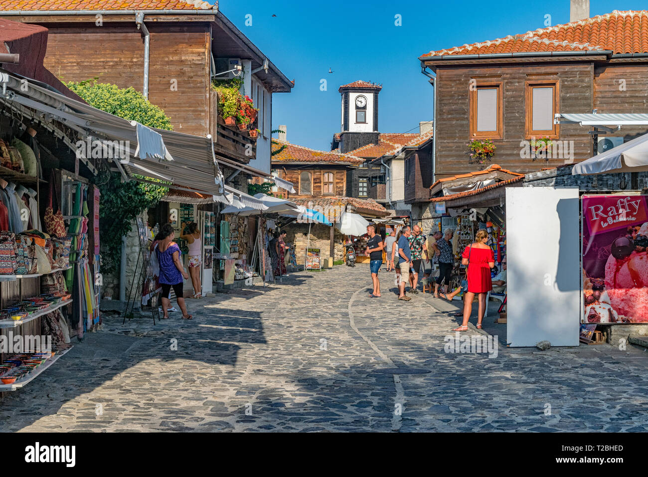 Nessebar, Bulgaria - 2 Sep 2018: Tourists on the beautiful streets of Nesebar ancient city on a sunny day with blue sky. Nessebar, Nesebar or Nesebr i Stock Photo