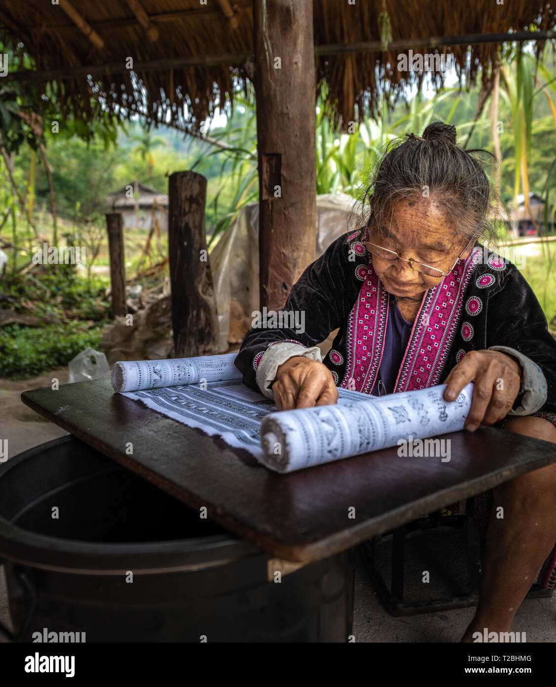 Baan Tong Luang Chiang Mai Thailand April 16 2018 elderly tribal woman working on her batik process Stock Photo