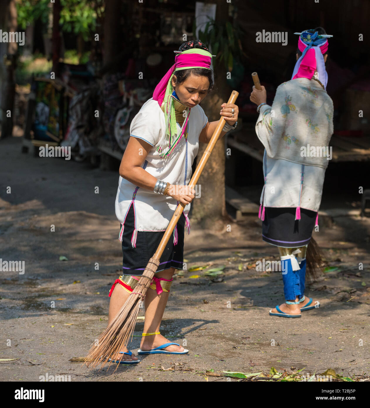 Baan Tong Luang Chiang Mai Thailand April 16 2018 Long Neck Karen Woman Sweeping leaves after rain storm went through their village Stock Photo