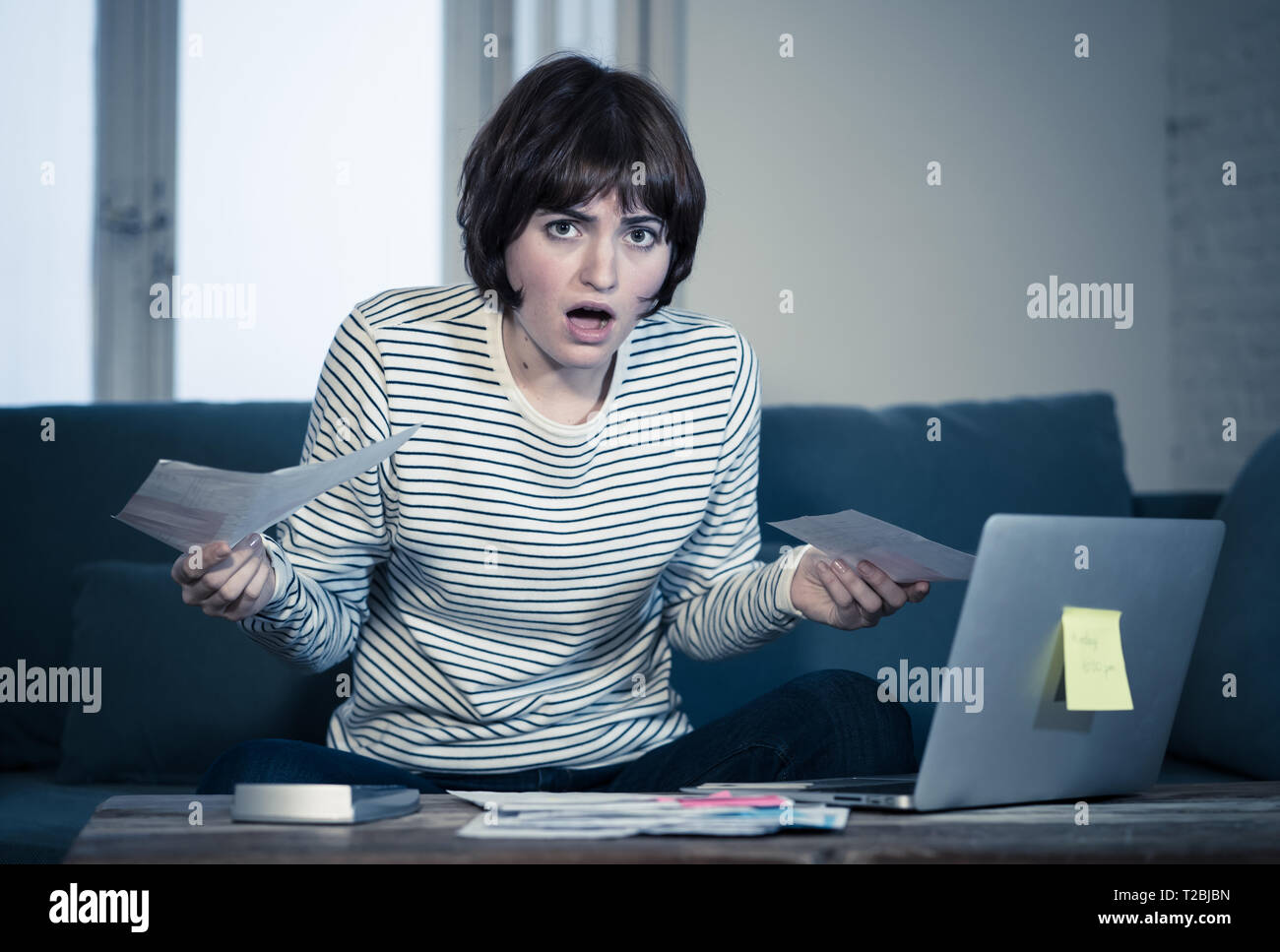 Worried and desperate young woman in stress accounting home or small  business finances with too much debts and expenses. In online banking,  paying bil Stock Photo - Alamy