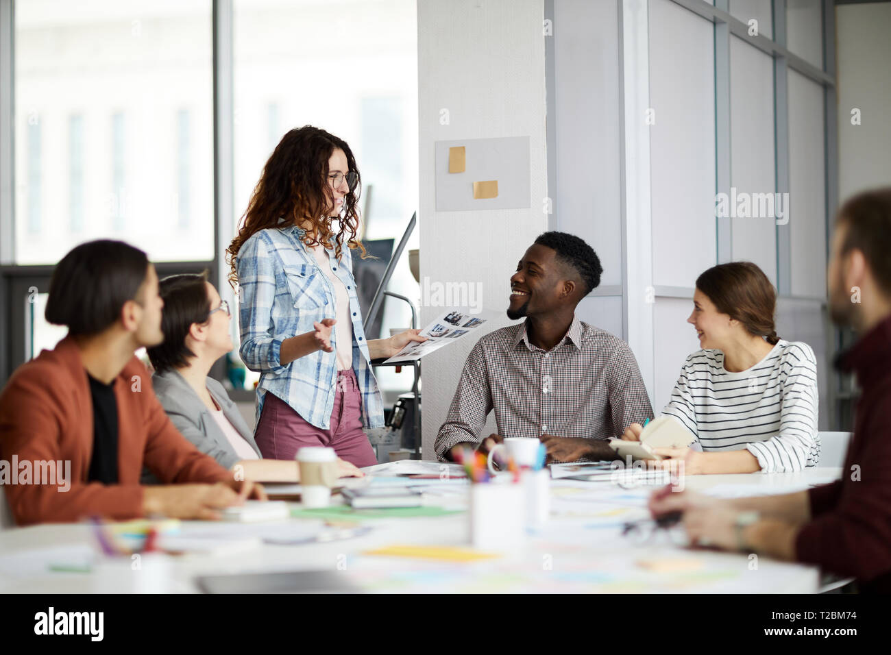 Portrait of creative multi-ethnic team collaborating on project during meeting in office, copy space Stock Photo
