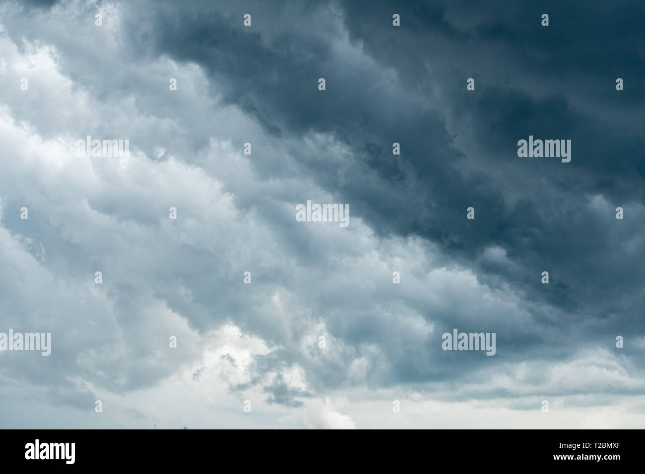 storm cloud background during raining. Dark Clouds. Huge black clouds ...