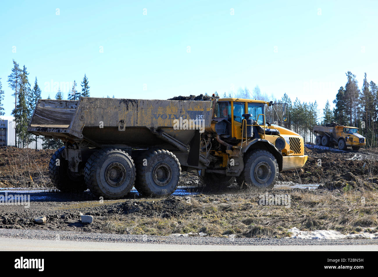 Lieto, Finland - March 22, 2019: Volvo articulated dumpers working at a construction site in South of Finland on a day of spring. Stock Photo