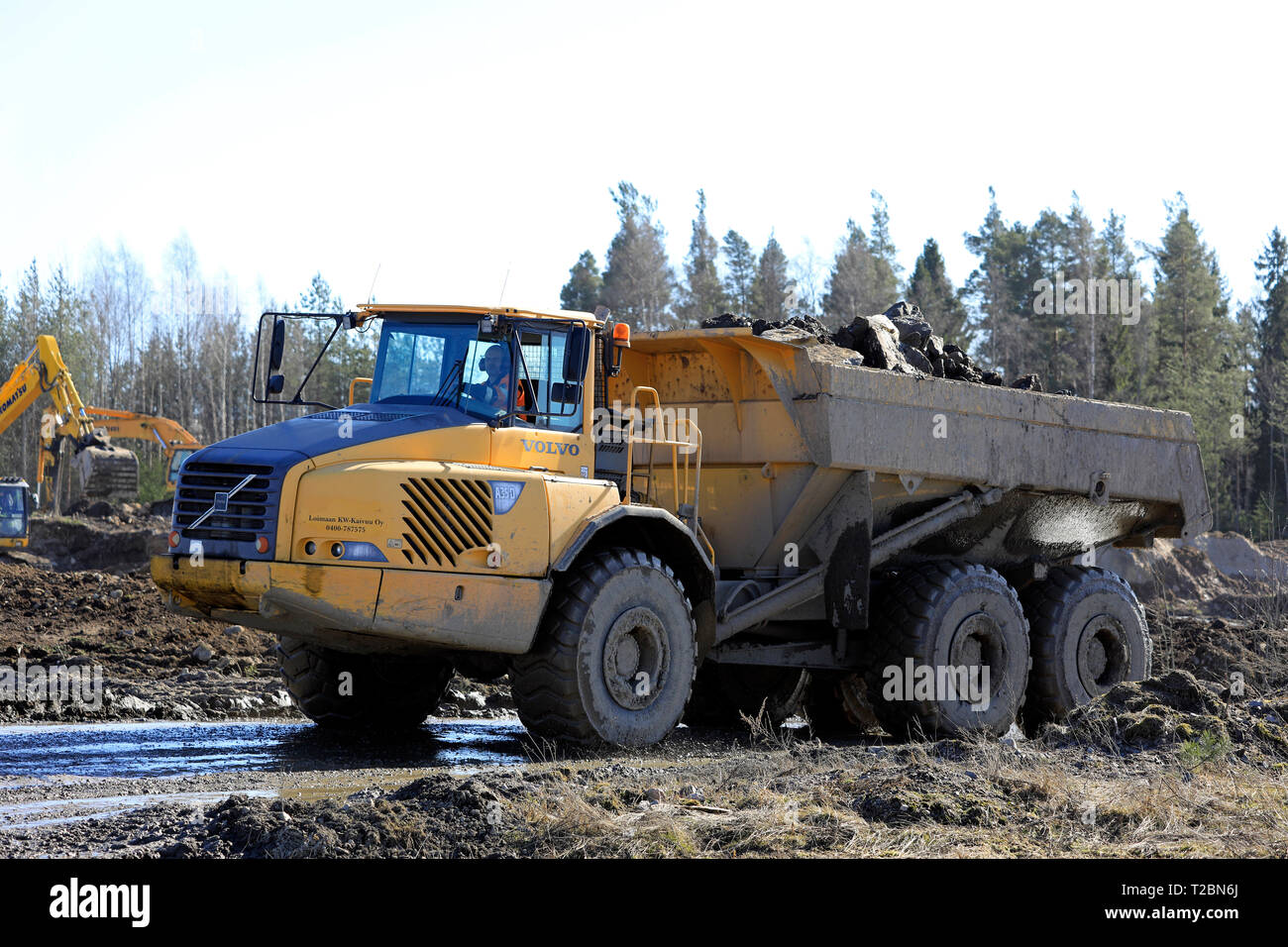 Lieto, Finland - March 22, 2019: Volvo A35D articulated dumper with a load of stone and gravel at work on construction site in South of Finland. Stock Photo