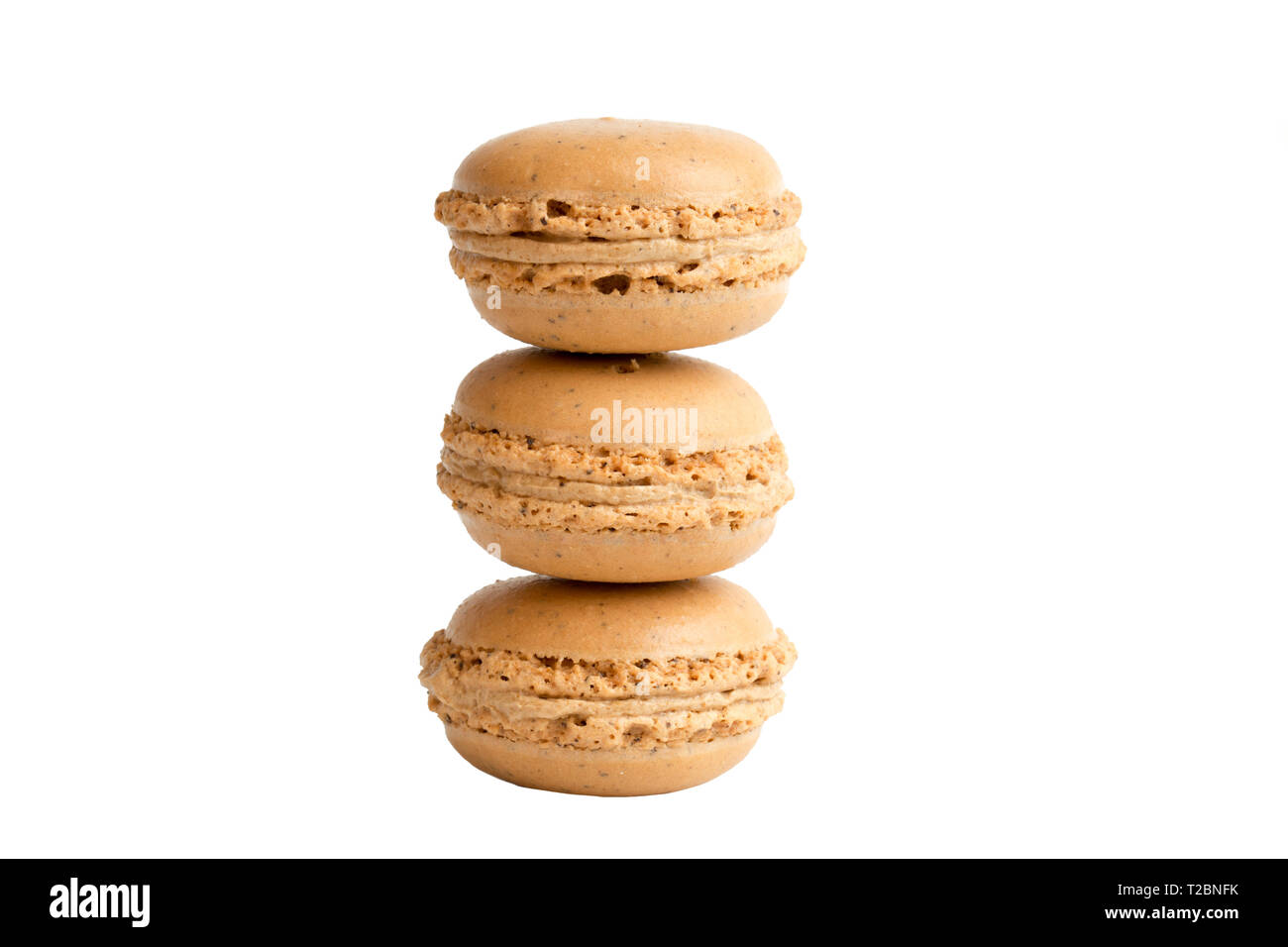 Three coffee macaroons stack on top of each other isolated on white ...