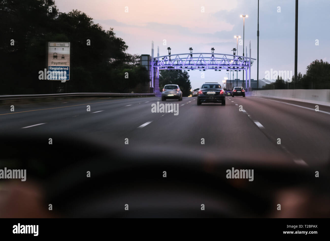 Johannesburg, Gauteng, South Africa - March 30th, 2019. Controversial E-toll gantry, gate on a major highway. Shot from inside a motor vehicle to show Stock Photo