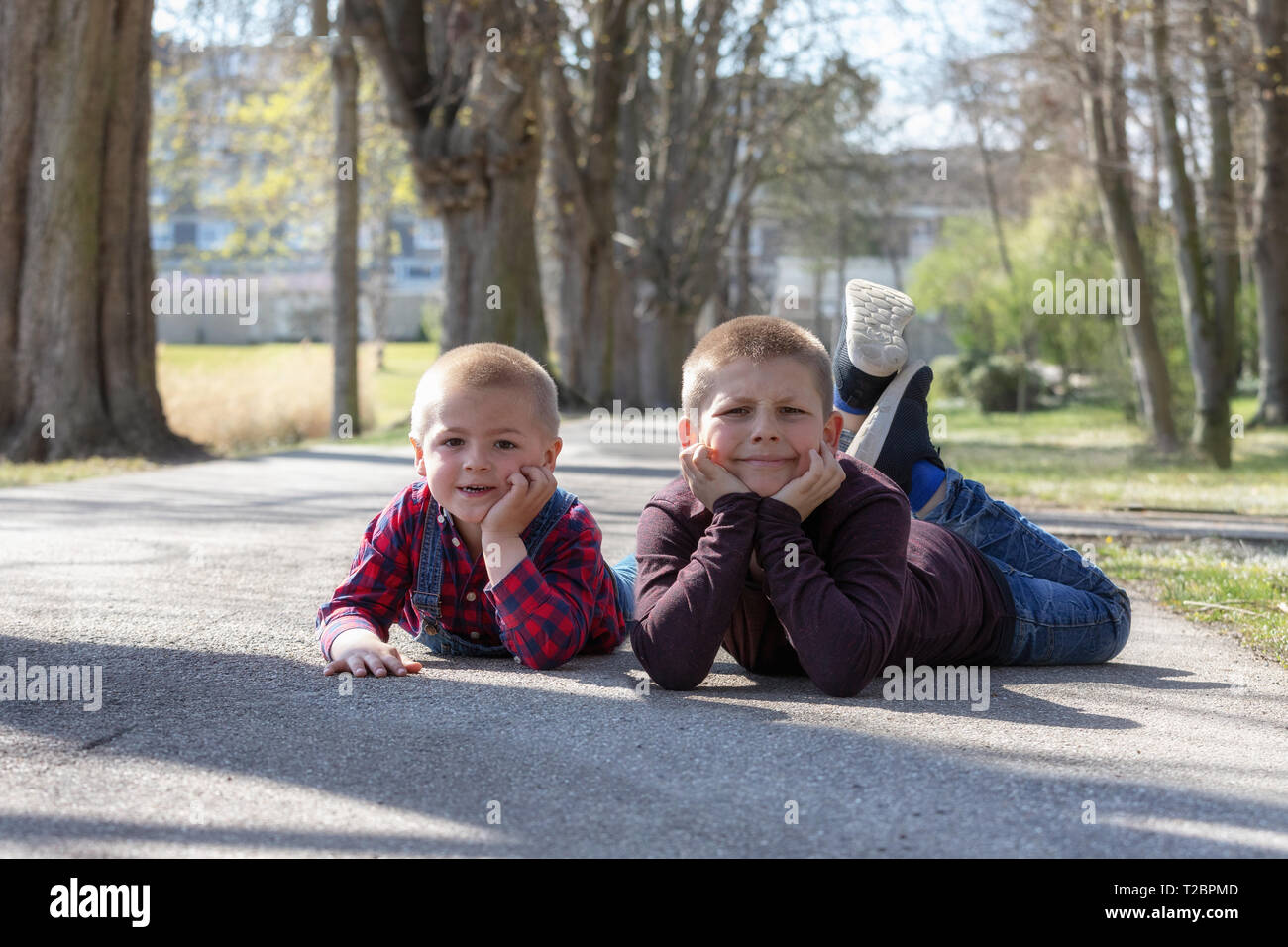 Group happy children lying on hi-res stock photography and images - Alamy