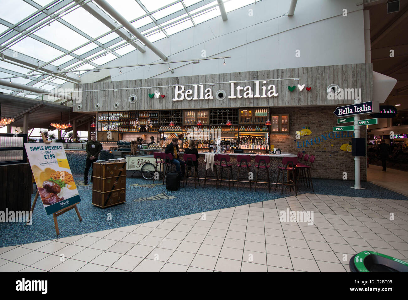Bella Italia at Luton Airport UK restaurant notice board  staff sign signs food eat eating sit seating sitting down area mall bar area waiting for fly Stock Photo