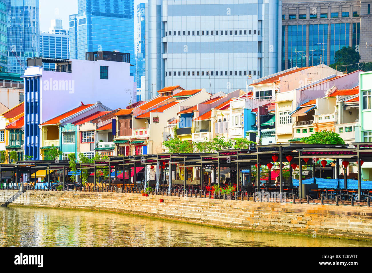 Cityscape with colorful bars, restaurants and stores by the Singapore River along Boat Quay