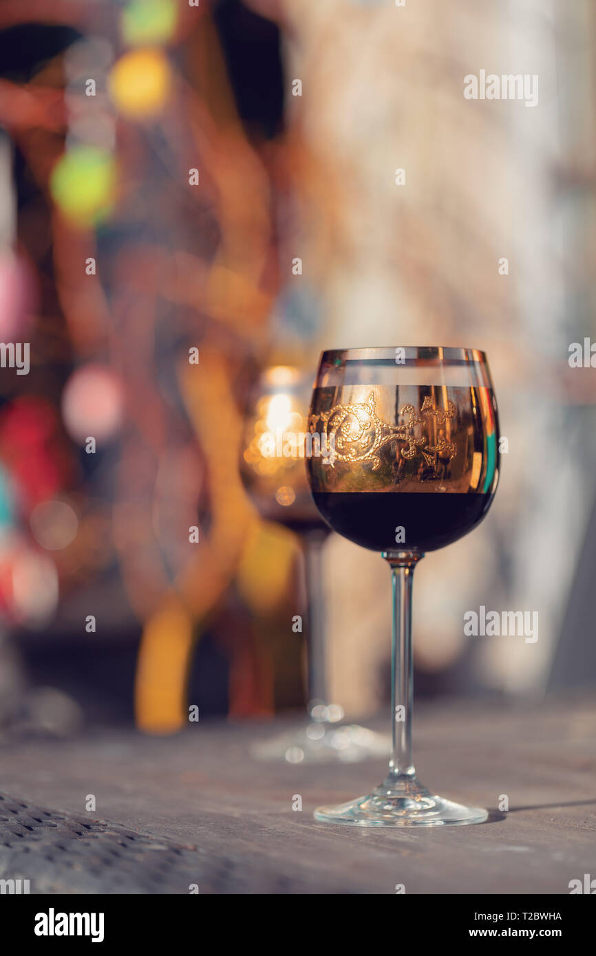 vine glass and easter eggs in blurry background. Spring easter concept. Stock Photo