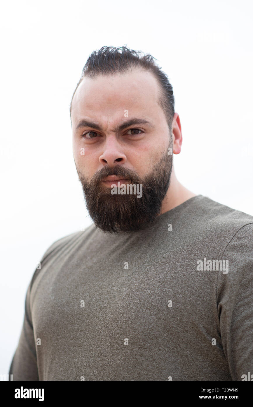 Angry bearded man staring Stock Photo