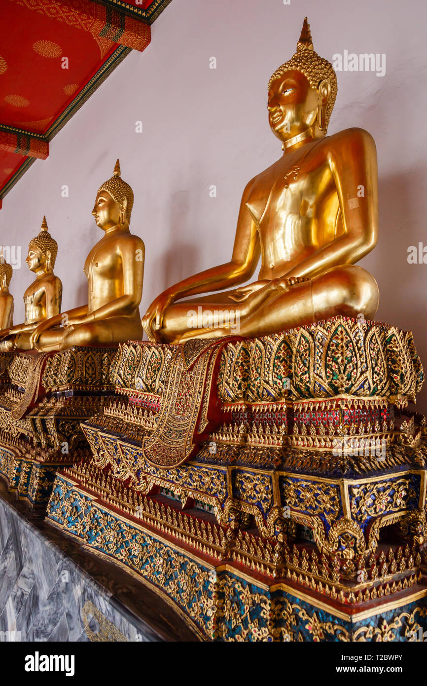 Sitting golden Buddha statues in wat pho temple in Bangkok Stock Photo ...