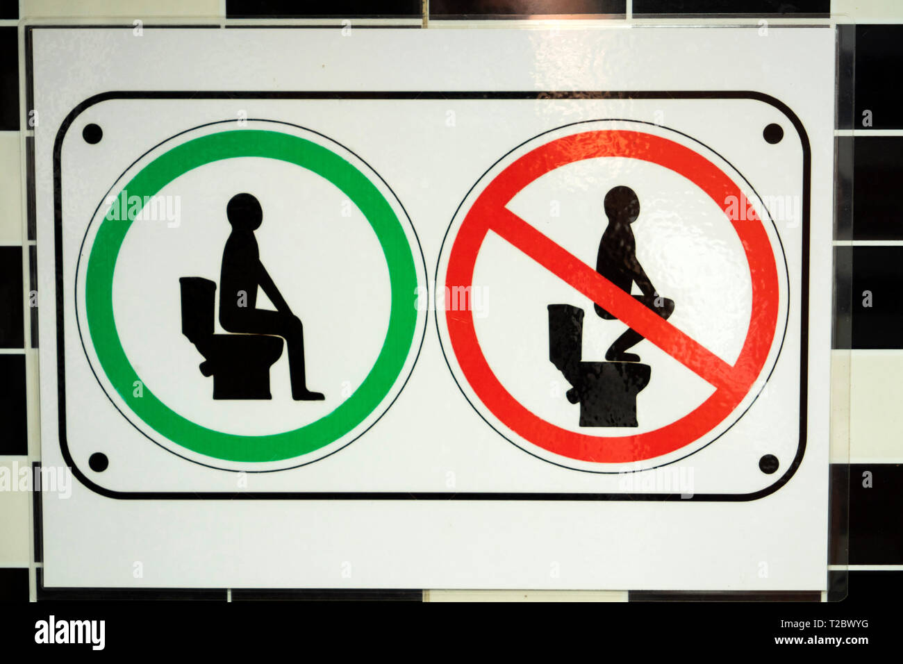 Cambodia, Kampong (Kompong) Cham, do not stand on toilet seat sign in Café toilets Stock Photo