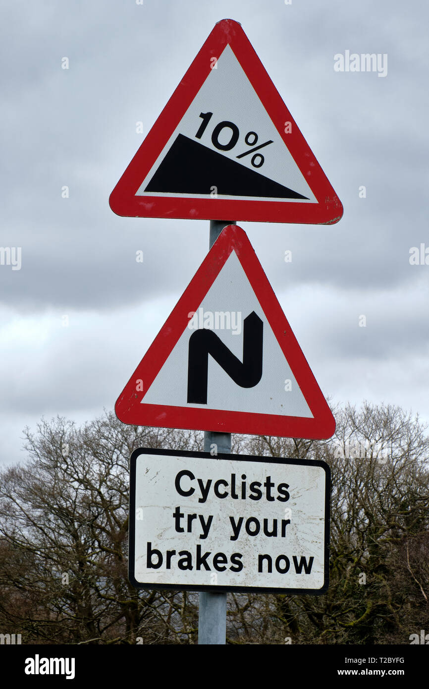 Cyclists Try Your Brakes Now Sign near Roger Ground, Hawkshead, Lake District, Cumbria Stock Photo