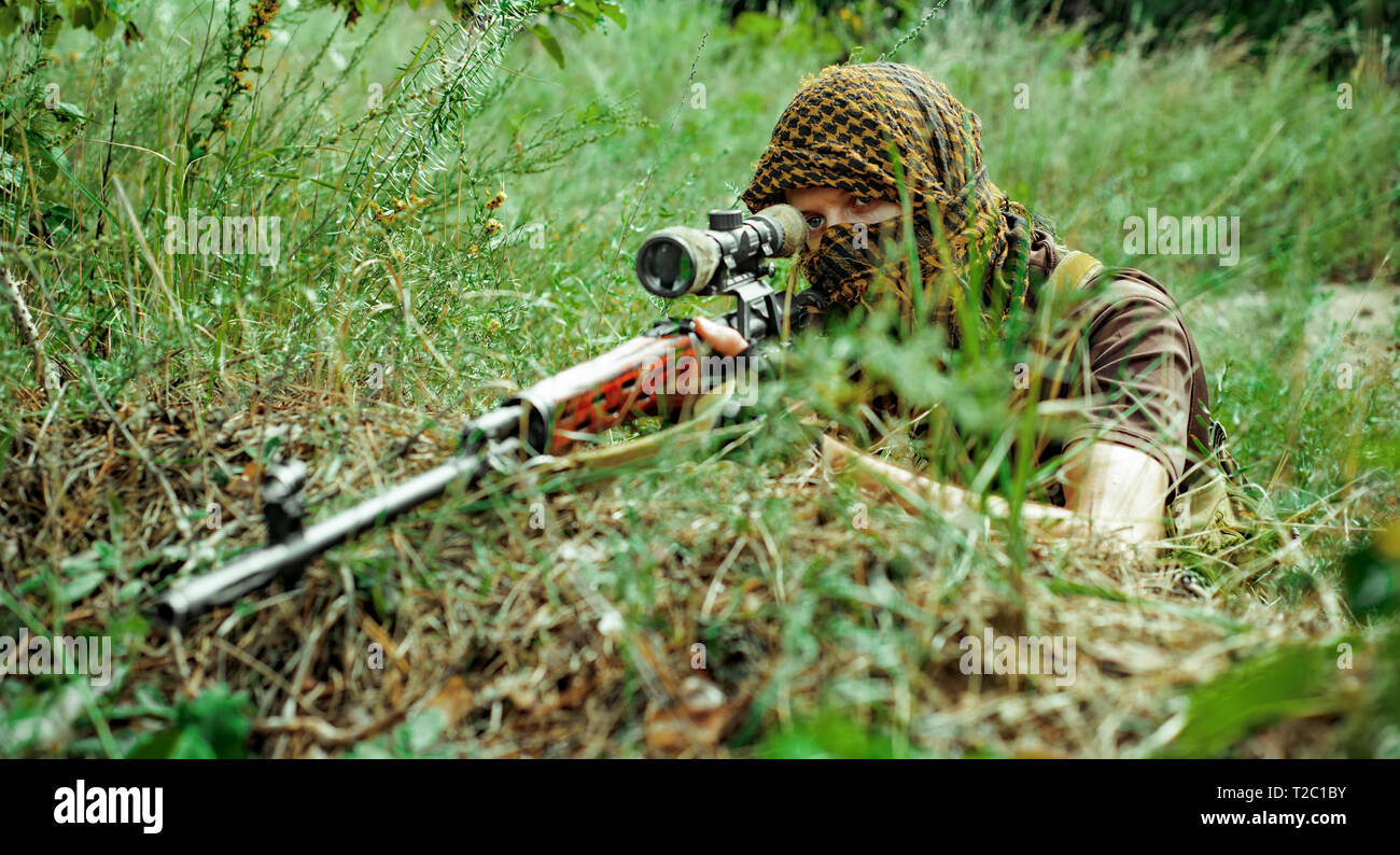 camouflaged sniper rifle with optic sight Stock Photo - Alamy