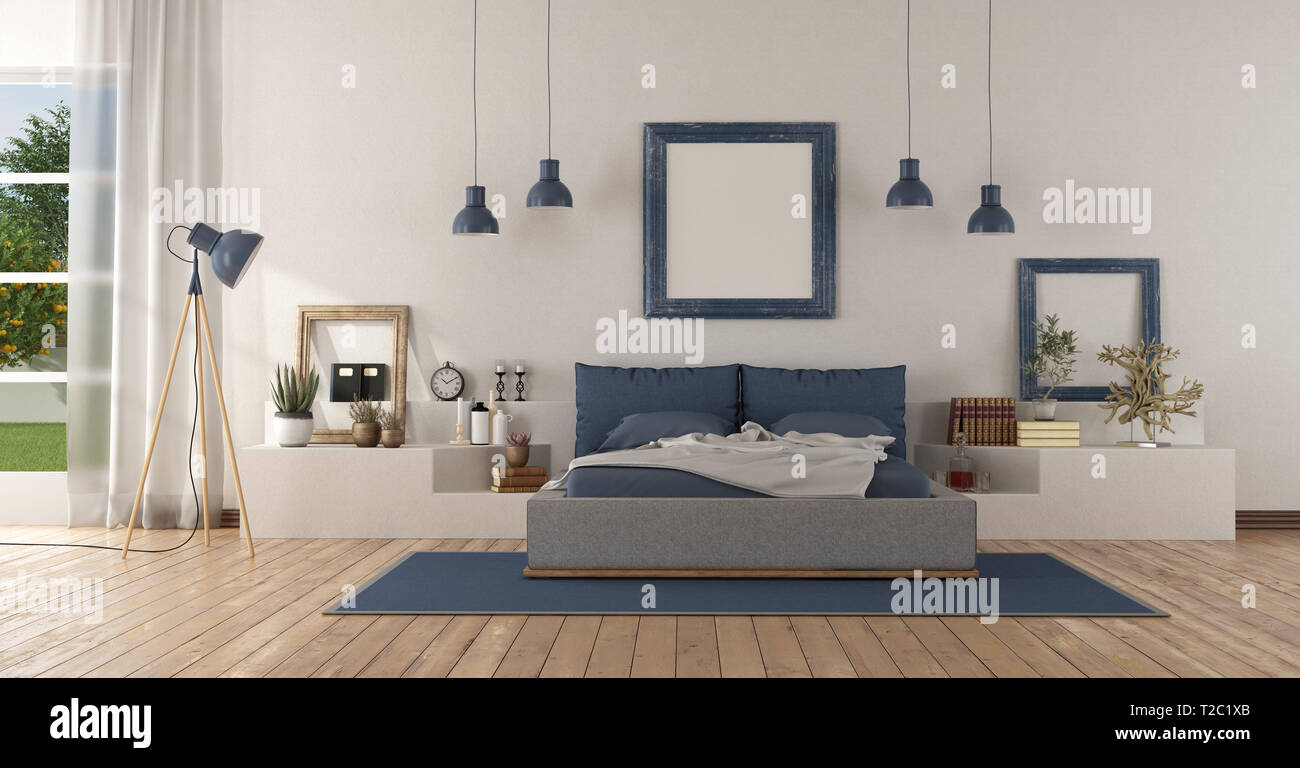 Modern white and blue master bedroom with double bed on a white masonry structure - 3d rendering Stock Photo