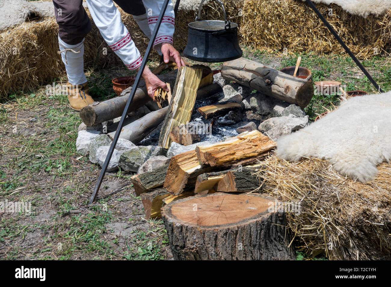 Male hand kindling traditional outdoor fireplace Stock Photo Alamy
