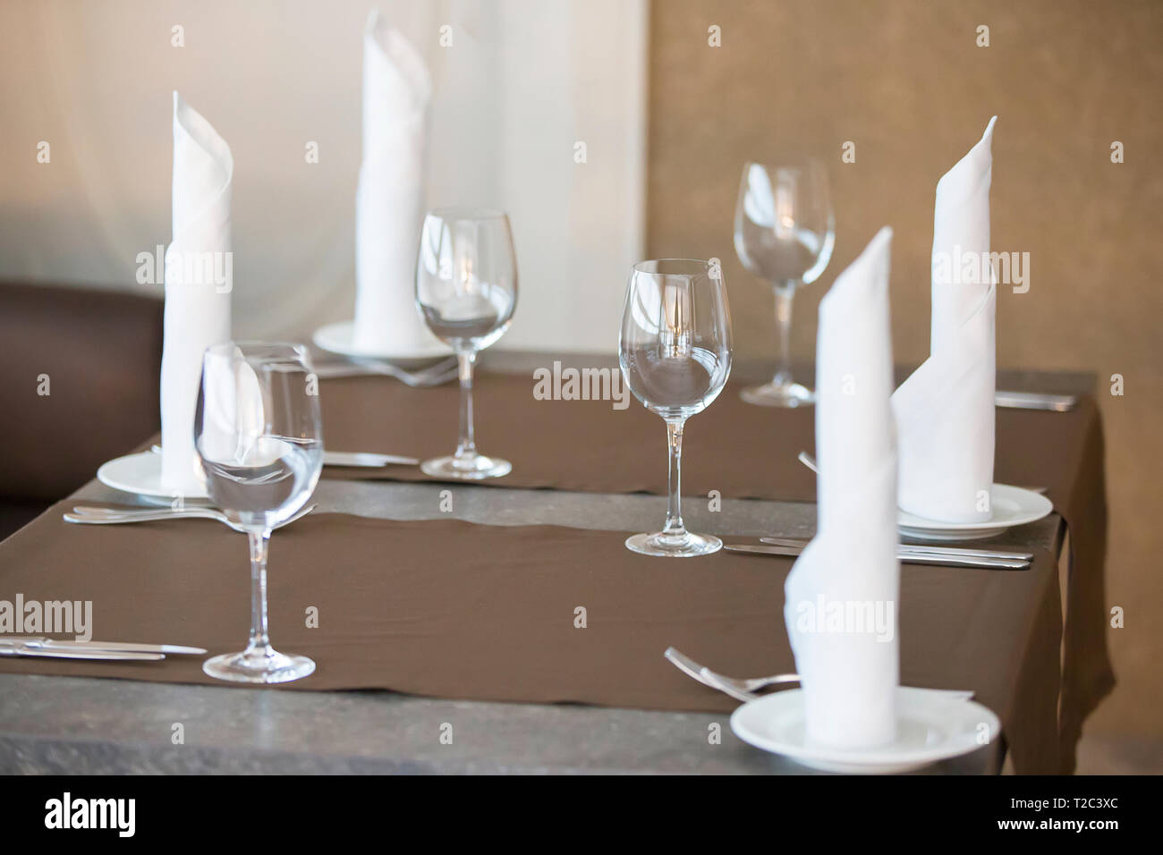 Table in a restaurant with empty glasses and plates Stock Photo - Alamy