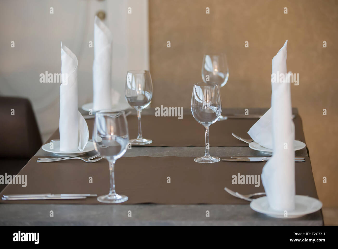 Table in a restaurant with empty glasses and plates Stock Photo - Alamy