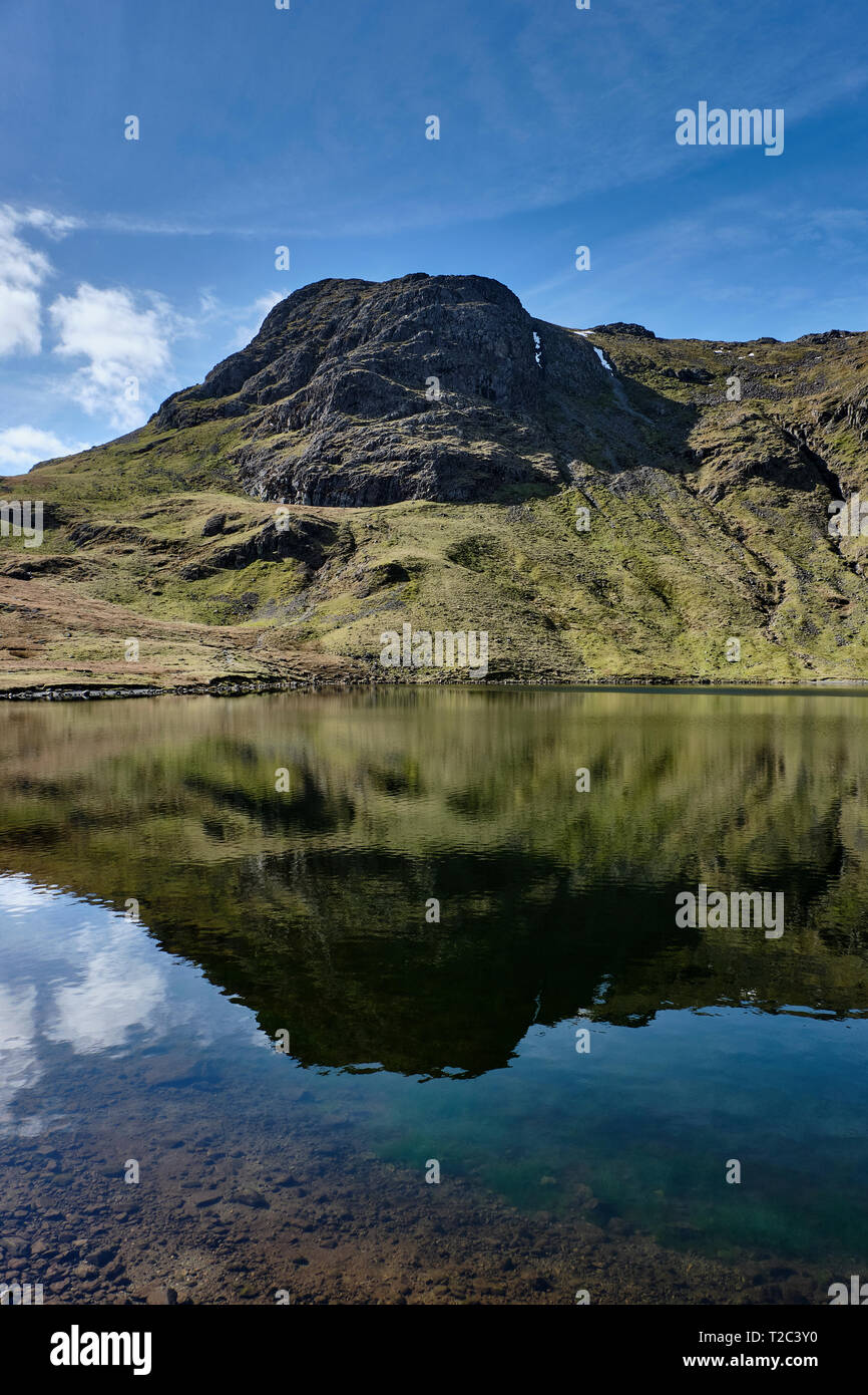 Harrison Stickle reflected in Stickle Tarn, Lake District, Cumbria Stock Photo