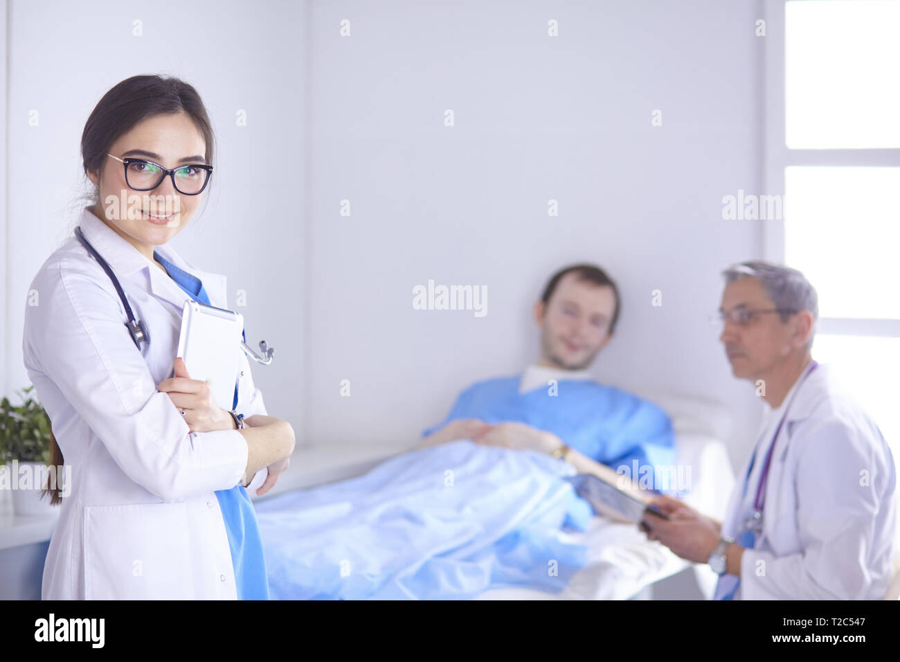 Doctor Checking Heart Beat Of Patient In Bed With Stethoscope Stock Photo Alamy