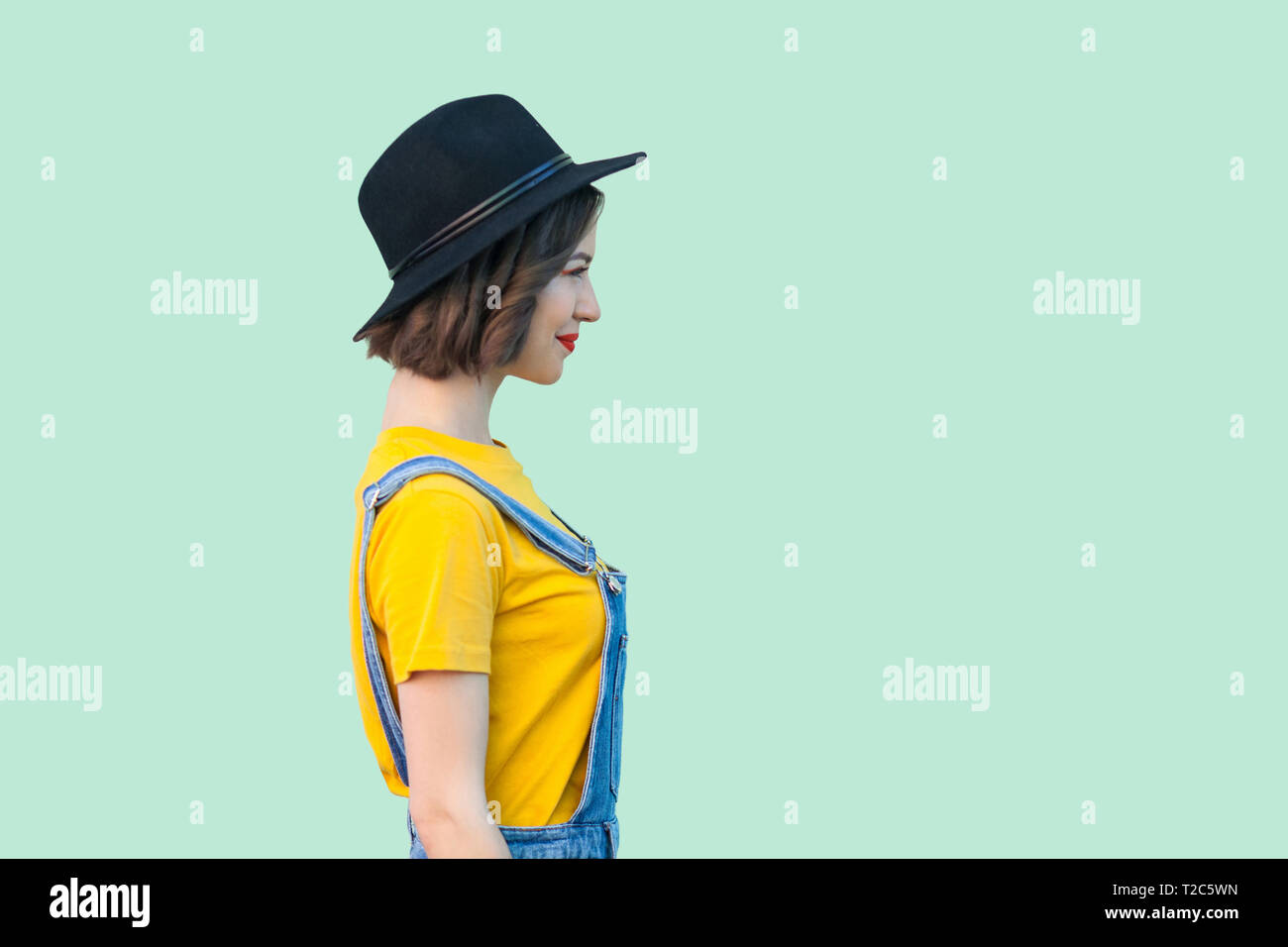 yellow baggy overalls