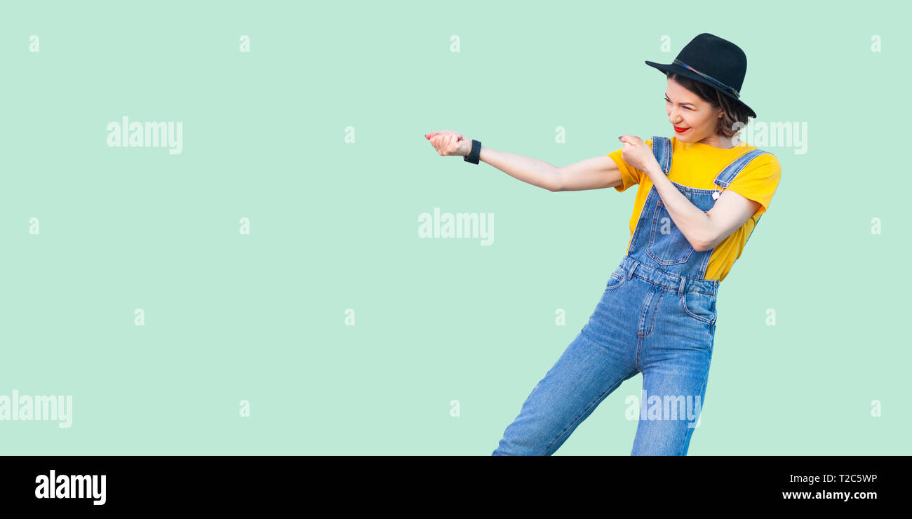 yellow baggy overalls