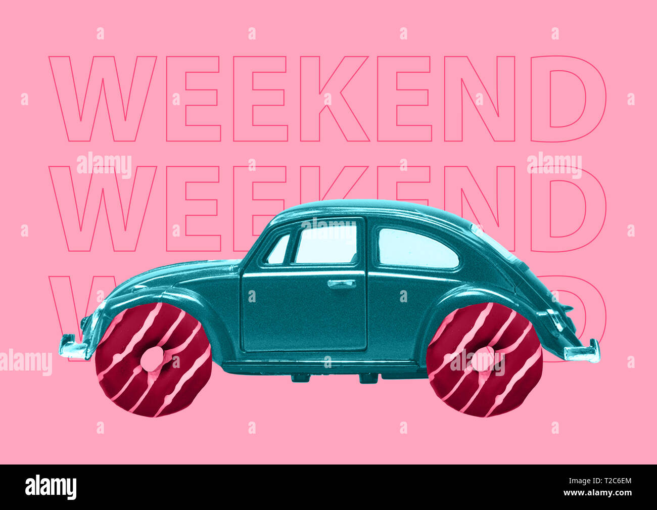 Sweet weekend starting here. A retro green car with pink donuts as a wheels against trendy coral background. A dream about holidays travel, trip or jo Stock Photo