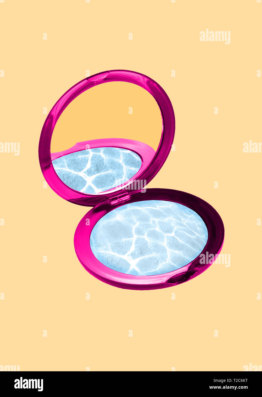 Reflection of reality. Dreams about resort or summer holidays. Sunny and beach mood. Pink cosmetic mirror filled with clean azure ocean or sea deep wa Stock Photo