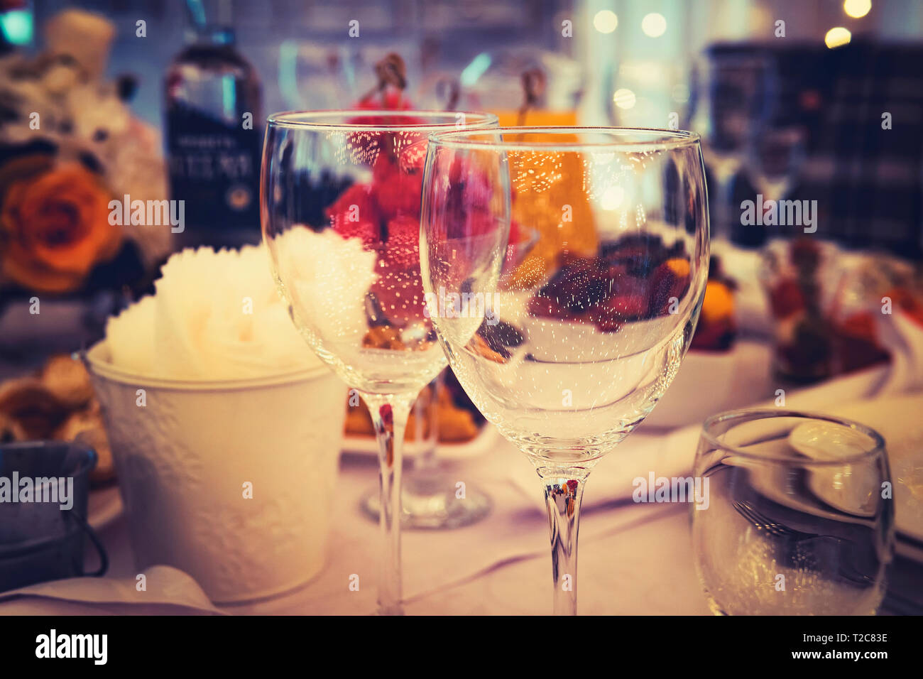 Close up of table appointments at a formal dinner party. Stemwares on a festive beautifully decorated wedding table. Empty clear wine glasses on a res Stock Photo
