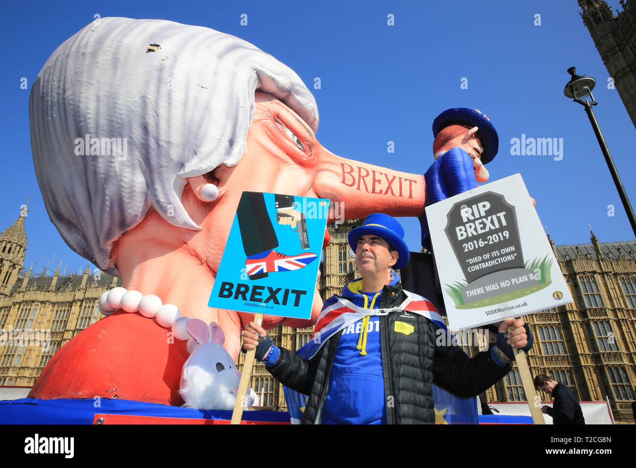 Westminster, London, UK. 1st Apr, 2019. Steven Bray, Mr. 'Shouty Man' and founder of Sodem, with the effigy. A giant effigy of Prime Minister Theresa May, with the British economy stuck to her long nose, is seen outside the Houses of Parliament, as Anti-Brexit protesters once again rally in Westminster on another day of voting on amendments in Parliament. The effigy, originally created for Duesseldorf carnival in Germany, first made the journey across the channel for the 'People's Vote' march two weeks ago. Credit: Imageplotter/Alamy Live News Credit: Imageplotter/Alamy Live News Stock Photo