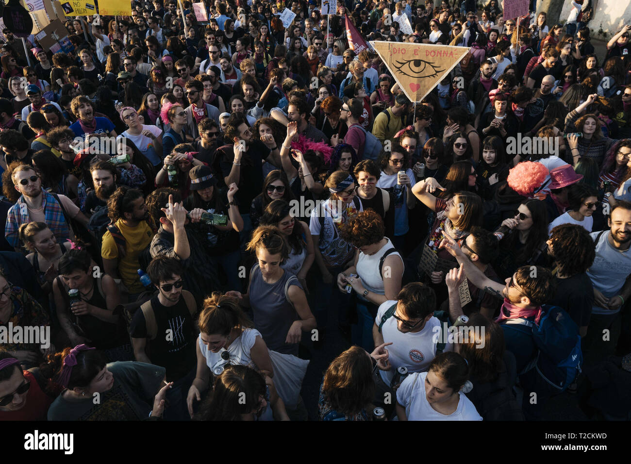 Verona, Veneto, Italy. 30th Mar, 2019. People seen gathering during the protest.The Italian Women organization Non Una di Meno called for a march against the thirteenth 'World Congress of Families'' (WCF) in Verona. The WCF gathers several representatives of 'pro-life movements'' in Europe and abroad, personalities from the religious world against abortion and it's reportedly connected to far-rights movements. Non Una di Meno and other associations protest against the WCF's positions against abortion, homosexuality and their aims to write a global agenda and politics on these mat Stock Photo