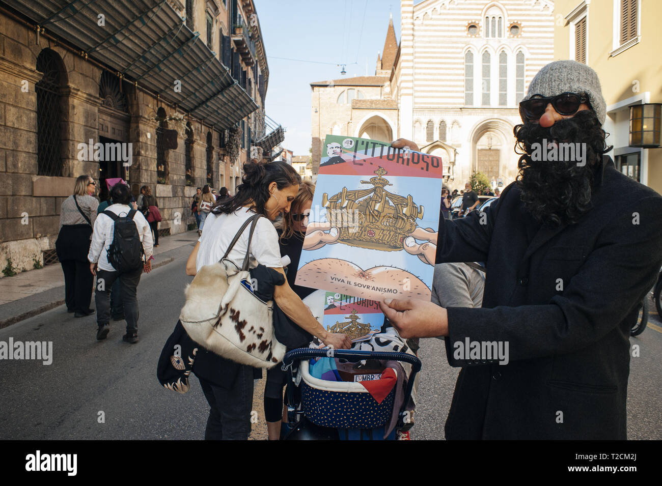 Verona, Veneto, Italy. 30th Mar, 2019. Participants seen trying to sensitize the abortion issues during the protest.The Italian Women organization Non Una di Meno called for a march against the thirteenth 'World Congress of Families'' (WCF) in Verona. The WCF gathers several representatives of 'pro-life movements'' in Europe and abroad, personalities from the religious world against abortion and it's reportedly connected to far-rights movements. Non Una di Meno and other associations protest against the WCF's positions against abortion, homosexuality and their aims to write a glo Stock Photo