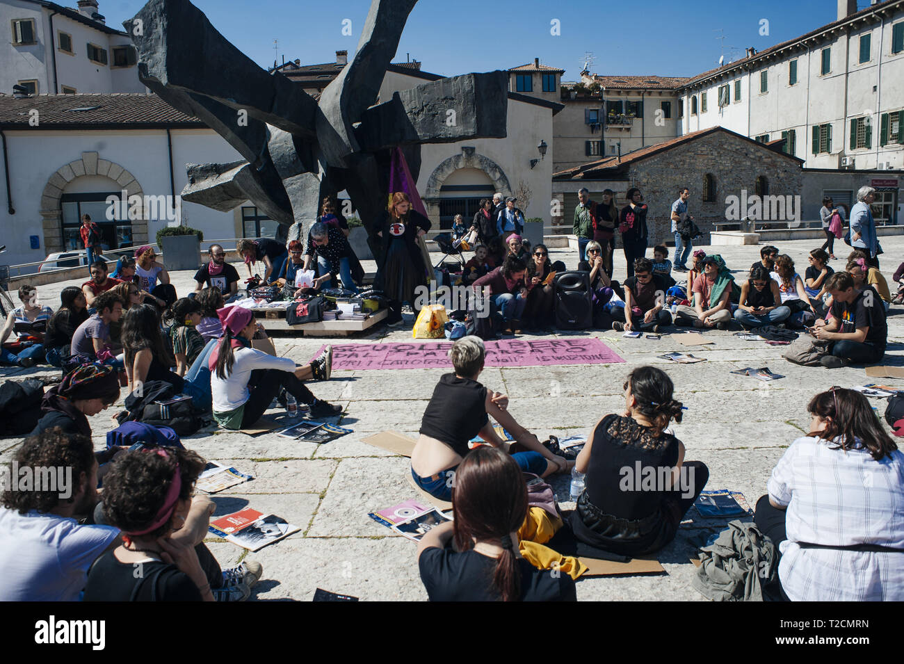 Verona, Veneto, Italy. 30th Mar, 2019. People seen debating before the protest.The Italian Women organization Non Una di Meno called for a march against the thirteenth 'World Congress of Families'' (WCF) in Verona. The WCF gathers several representatives of 'pro-life movements'' in Europe and abroad, personalities from the religious world against abortion and it's reportedly connected to far-rights movements. Non Una di Meno and other associations protest against the WCF's positions against abortion, homosexuality and their aims to write a global agenda and politics on these matt Stock Photo