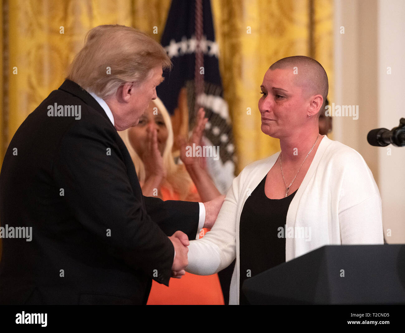 April johnson a beneficiary of the first step act shakes hands with