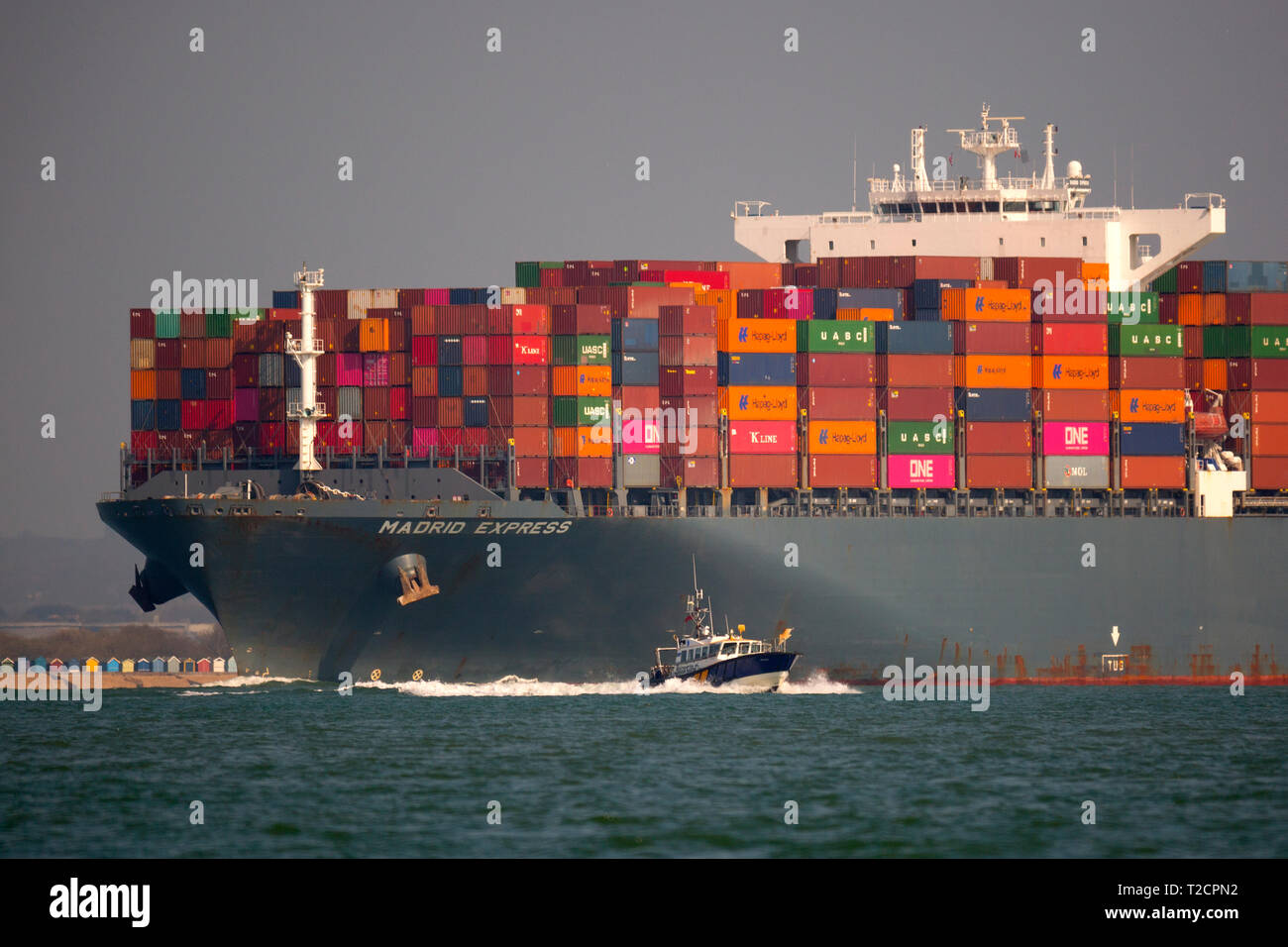 close up,Container,Ship,Madrid,Express,Southampton,Port,Harbour,Escourt,Launch,services,Master,departure,water,The Solent,Cowes,Isle of Wight,UK, Stock Photo
