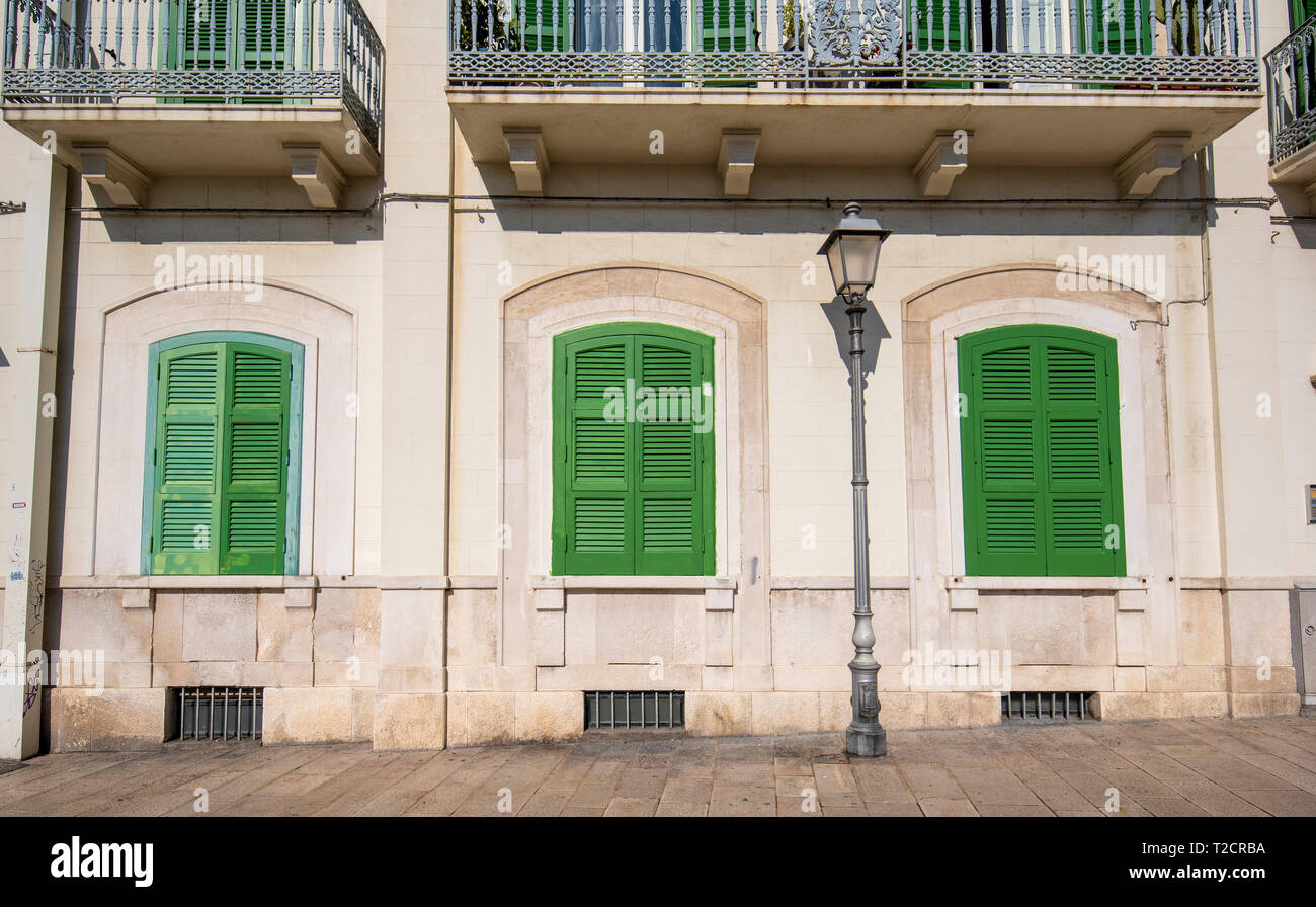 Front View Of A Wooden Green Windows On Yellow Wall Beautiful