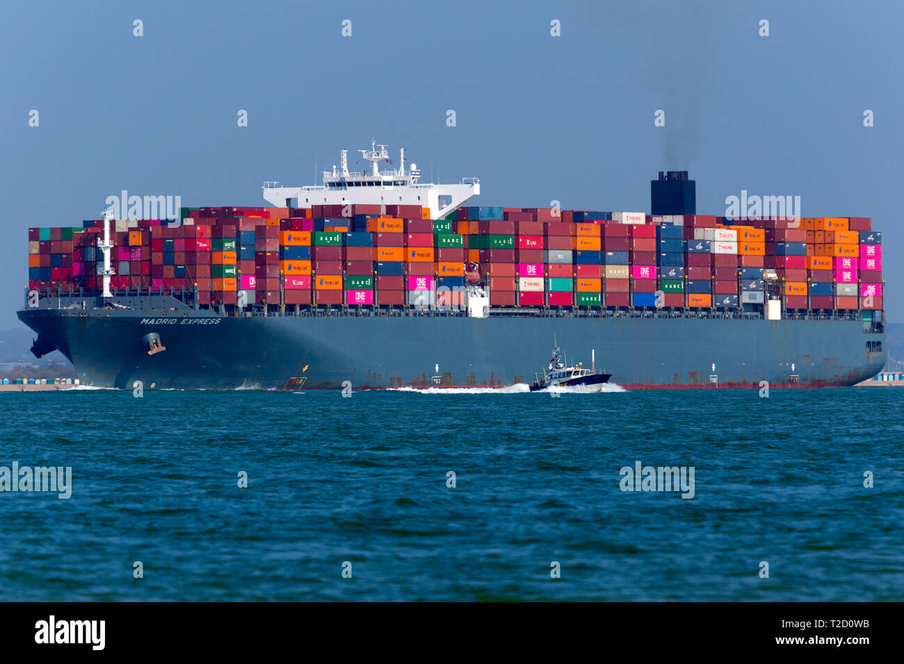 Container,Ship,Madrid,Express,Southampton,Port,Harbour,Escourt,Launch,services,Master,departure,water,The Solent,Cowes,Isle of Wight,UK, Stock Photo