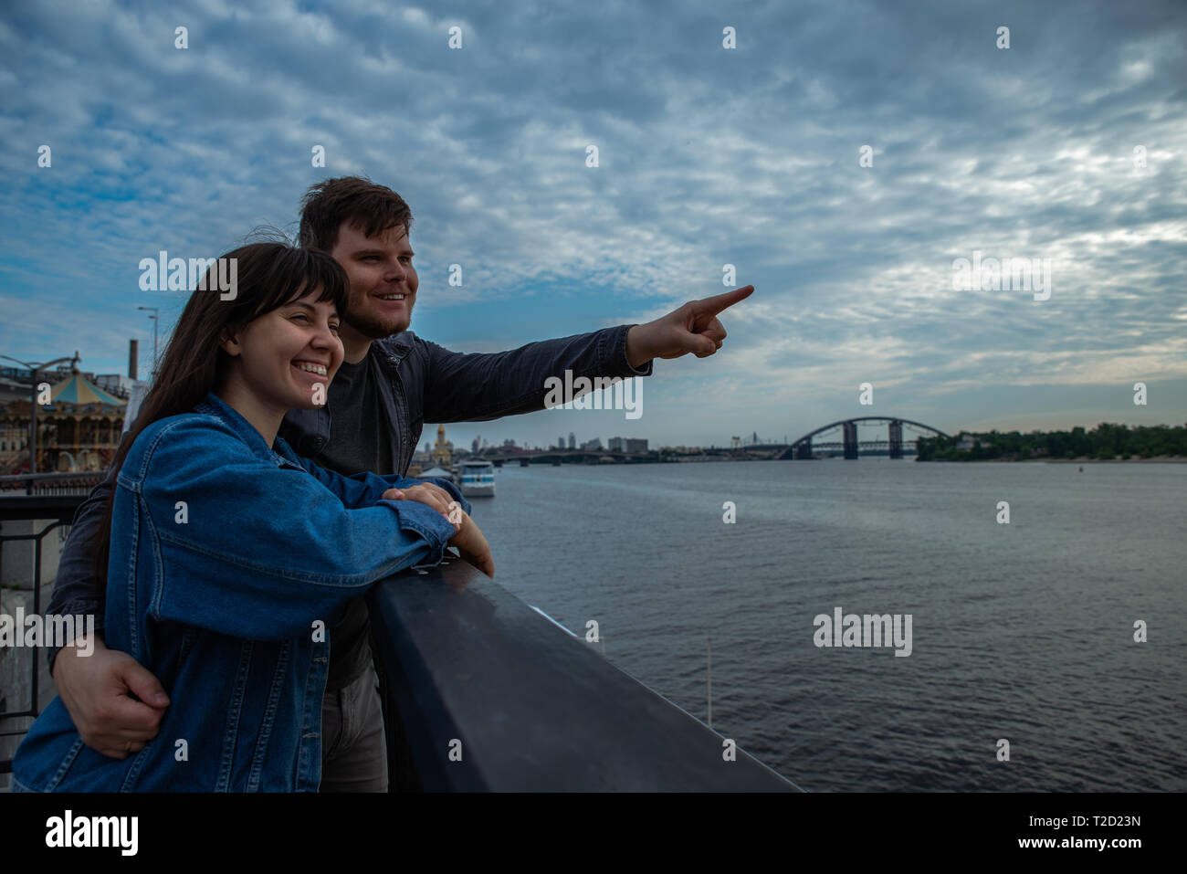 Young couple hugging riverside hi-res stock photography and images - Alamy