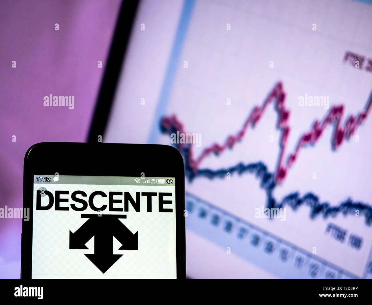 In this photo illustration a Descente Ltd.  logo seen displayed on a smart phone Stock Photo