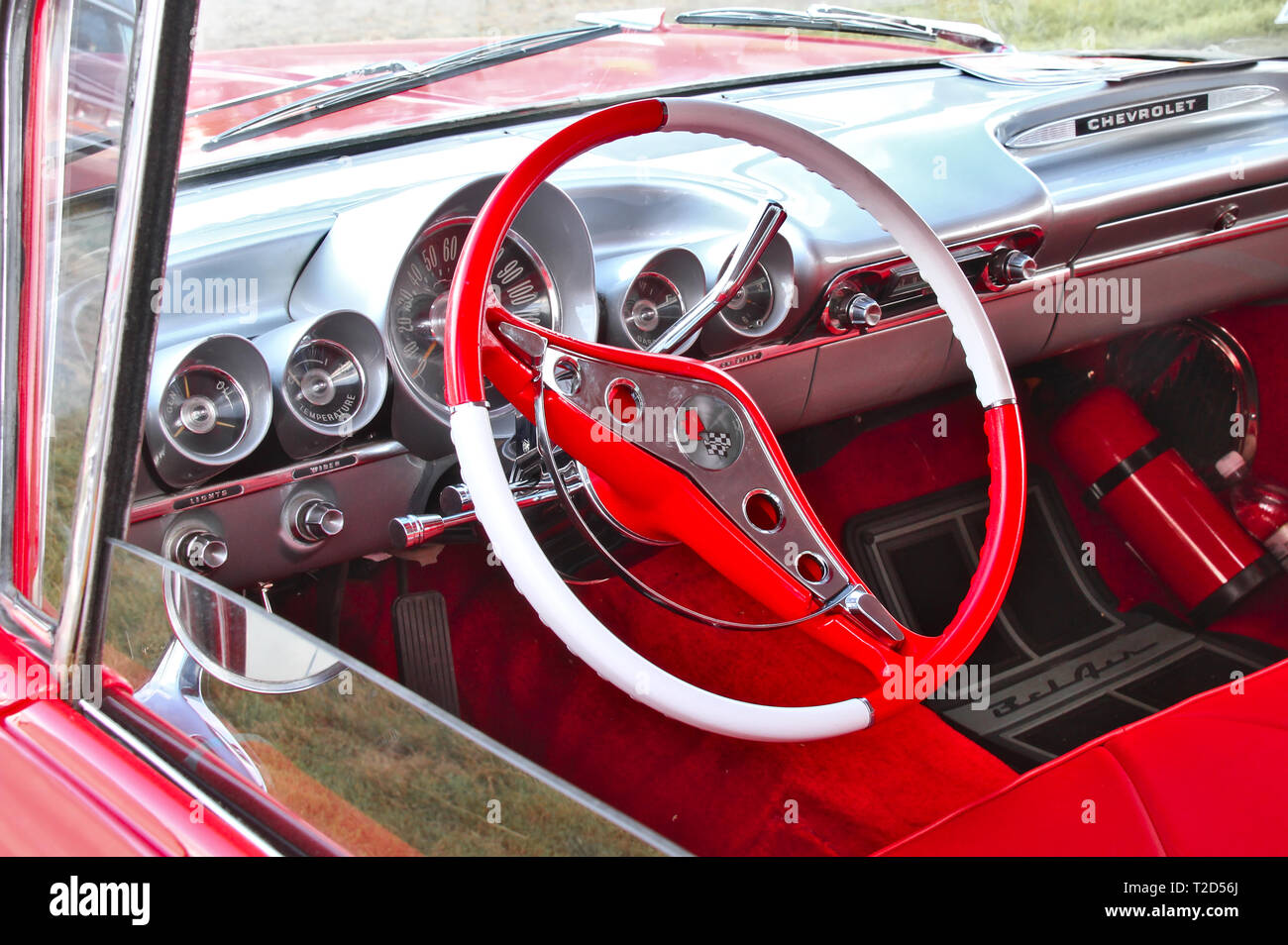 Red And White Interior Of A Restored Classic Car At Pick