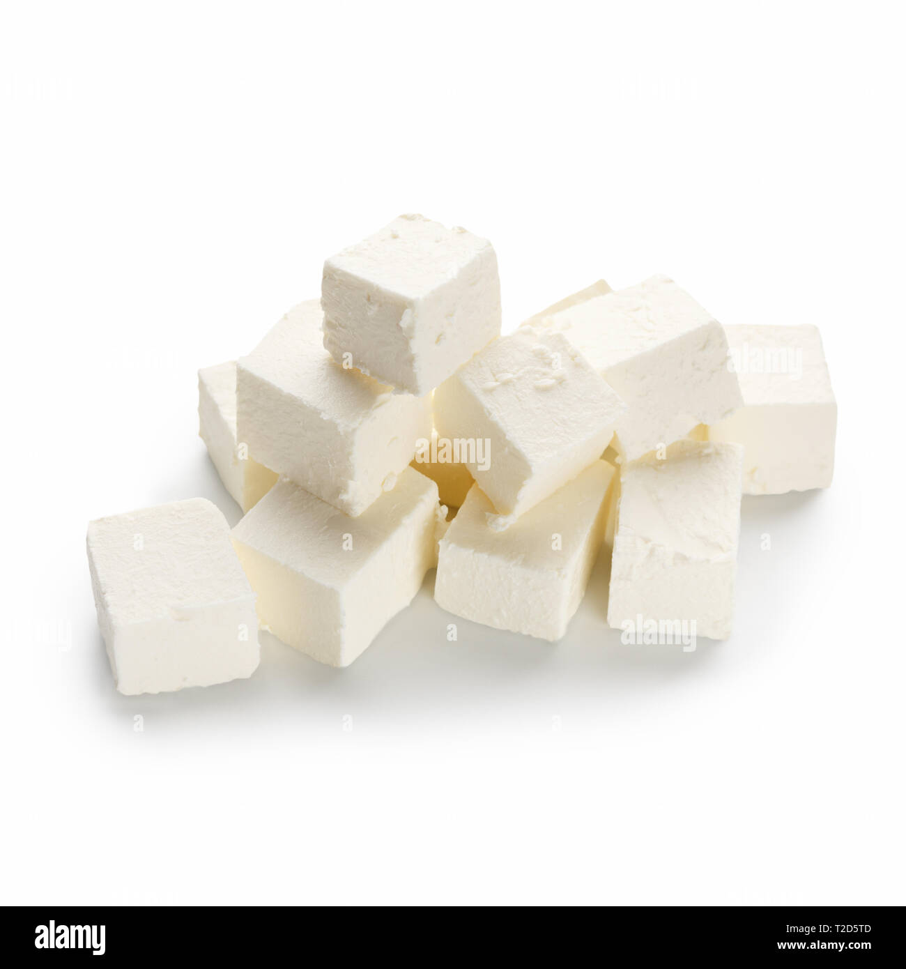 Feta cheese cubes pile on white background Stock Photo Alamy