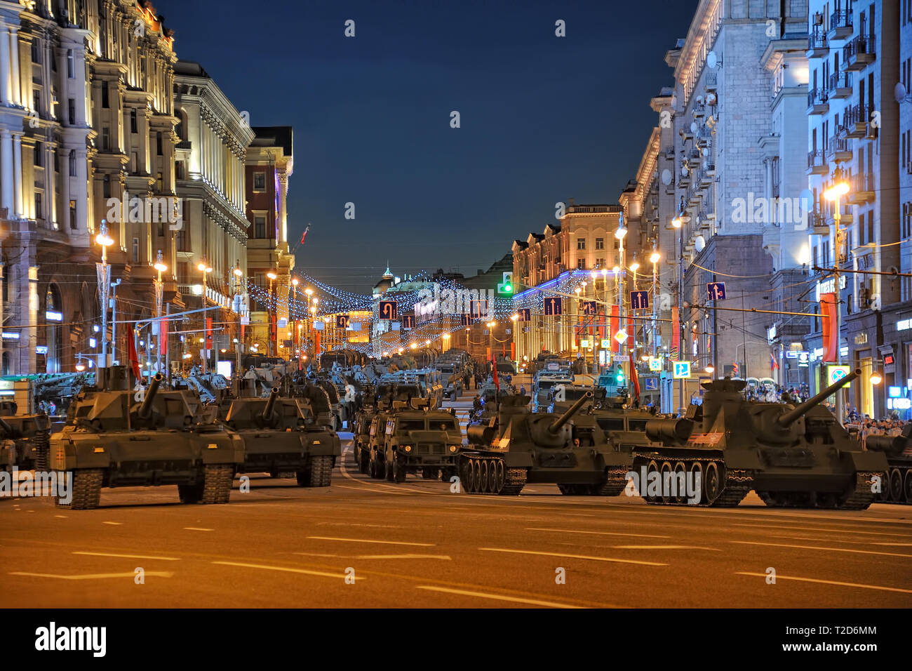 = Russian Military Hardware on Tverskaya Before Nighttime Rehearsal =  View from the beginning of Tverskaya on a huge amount of military vehicles line Stock Photo