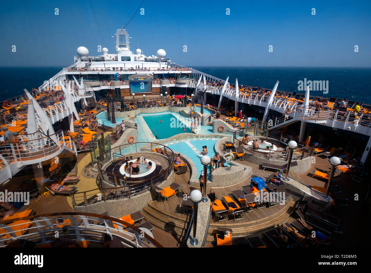 People enjoying the swimming pool on the cruise ship MSC Splendida Stock Photo