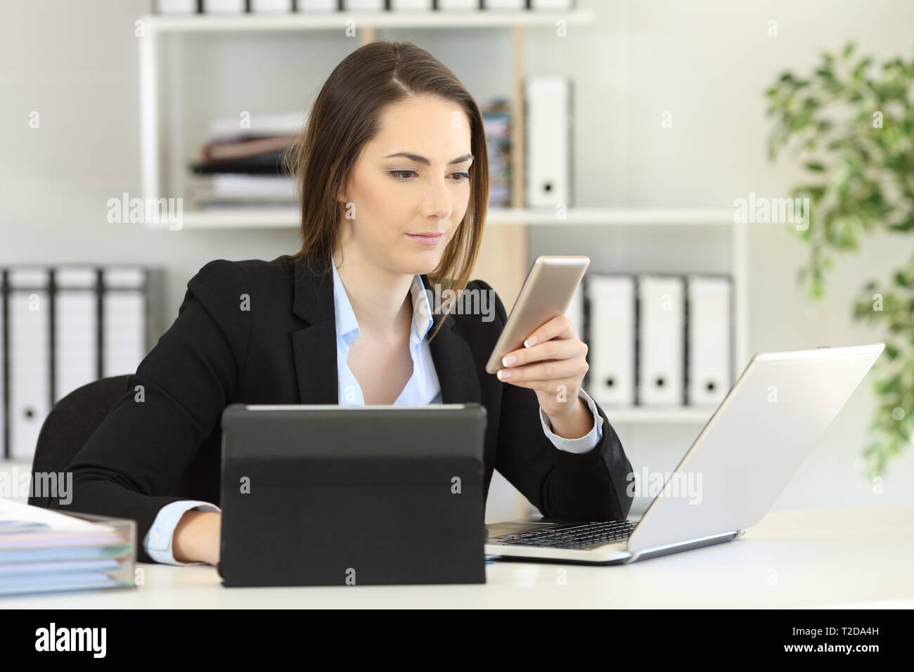Woman using laptop smartphone hi-res stock photography and images - Alamy