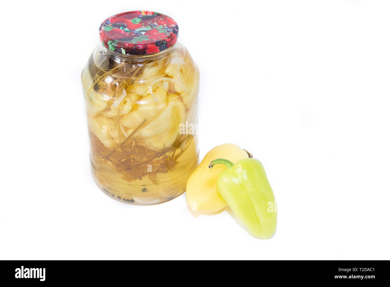 Marinated peppers in a jar isolated on white background. Homemade